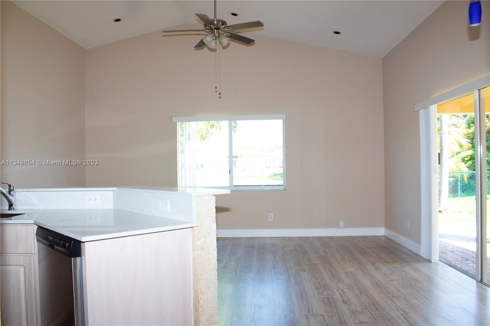 13221 Southwest 53rd Street Miramar, FL 33027 - Photo 24 of 32 a view of a kitchen with a dishwasher and a window
