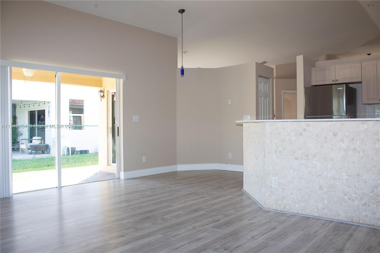 13221 Southwest 53rd Street Miramar, FL 33027 - Photo 26 of 32 a view of an empty room with wooden floor and a window