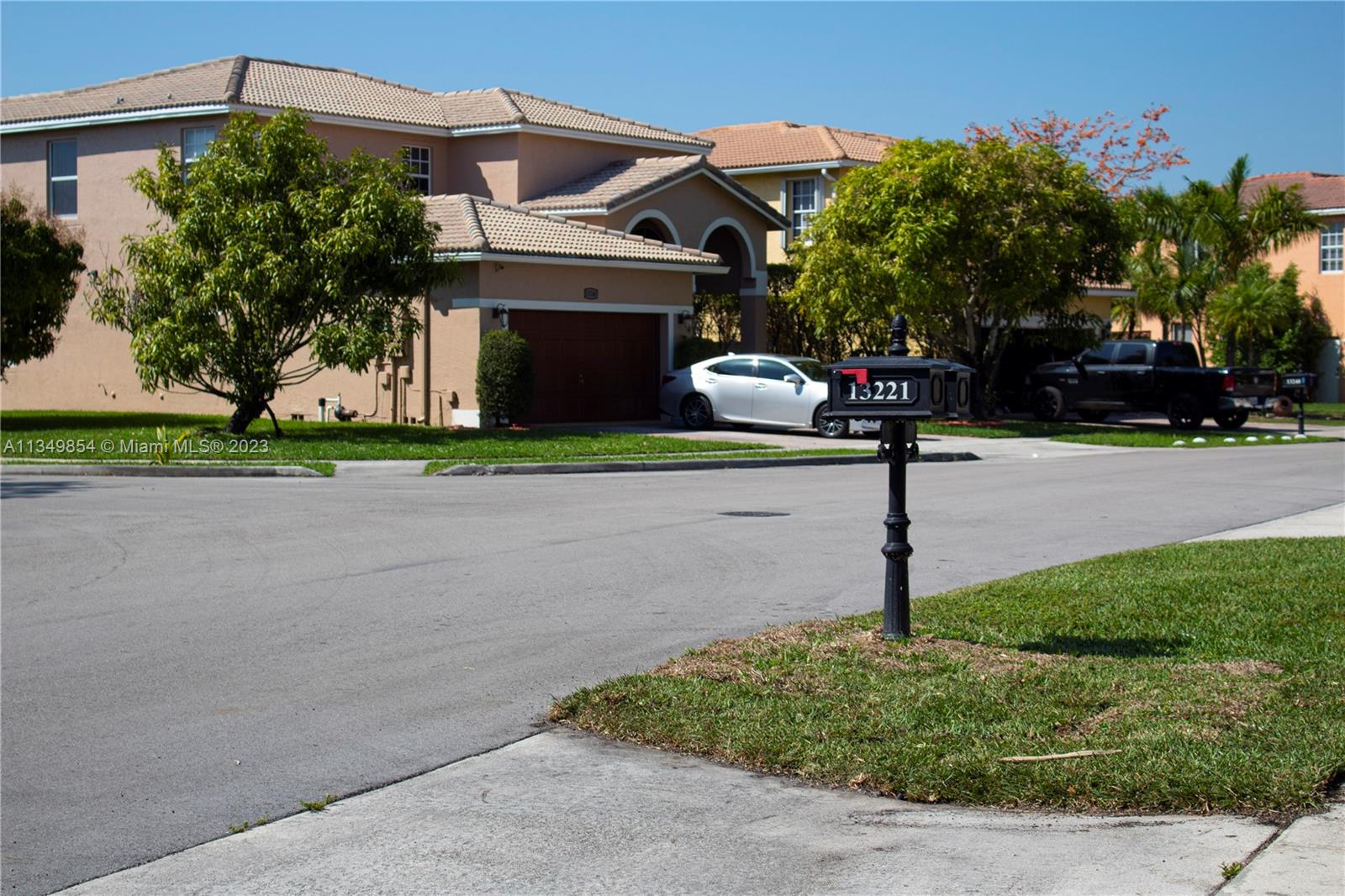 13221 Southwest 53rd Street Miramar, FL 33027 - Photo 3 of 32 a front view of a house with garden