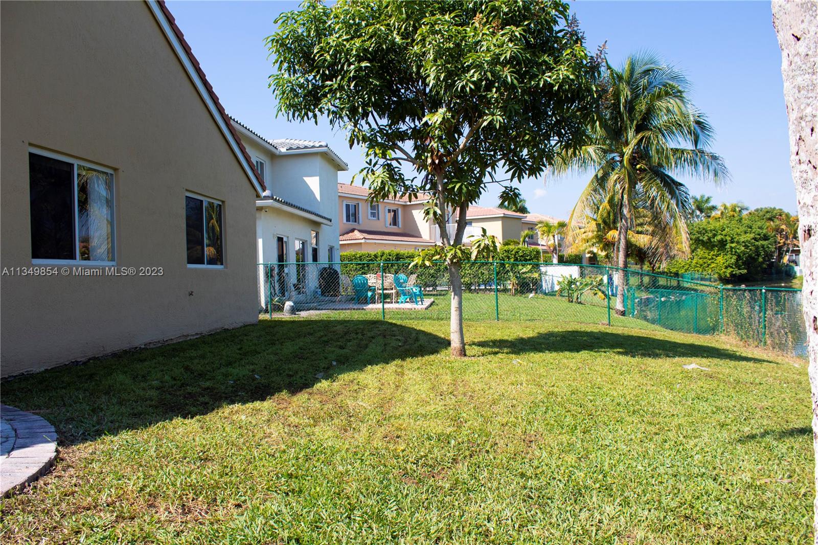 13221 Southwest 53rd Street Miramar, FL 33027 - Photo 5 of 32 a view of a house with a yard and a fountain