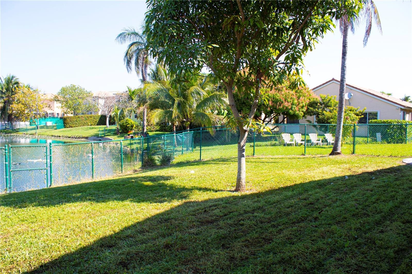 13221 Southwest 53rd Street Miramar, FL 33027 - Photo 7 of 32 a swimming pool with an outdoor space and seating area