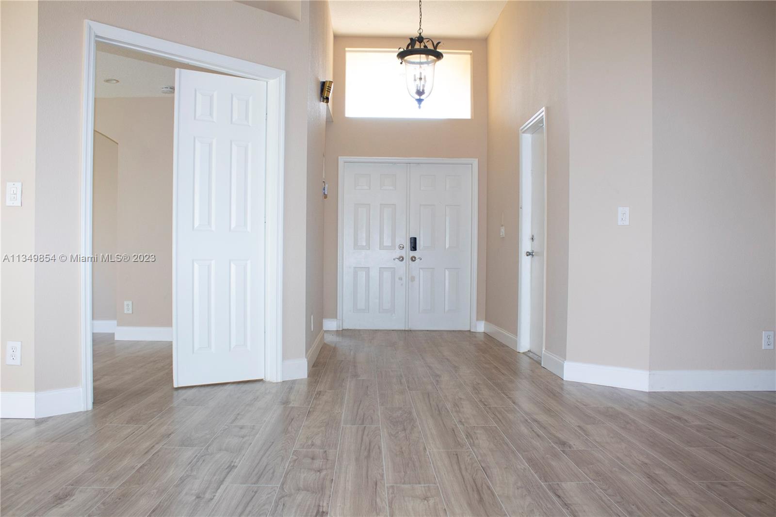 13221 Southwest 53rd Street Miramar, FL 33027 - Photo 8 of 32 wooden floor in an empty room