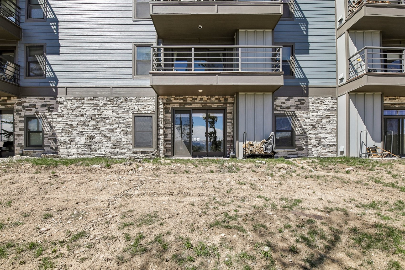 89310 Ryan Gulch Road, Unit 103 Silverthorne, CO 80498 - Photo 28 of 48 a front view of a house with a yard