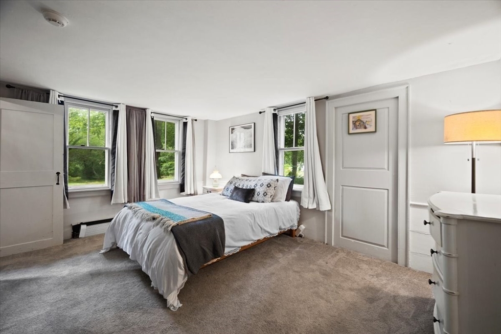 217 County Road Bourne, MA 02532 - Photo 15 of 30 a bed room with a bed and a lamp