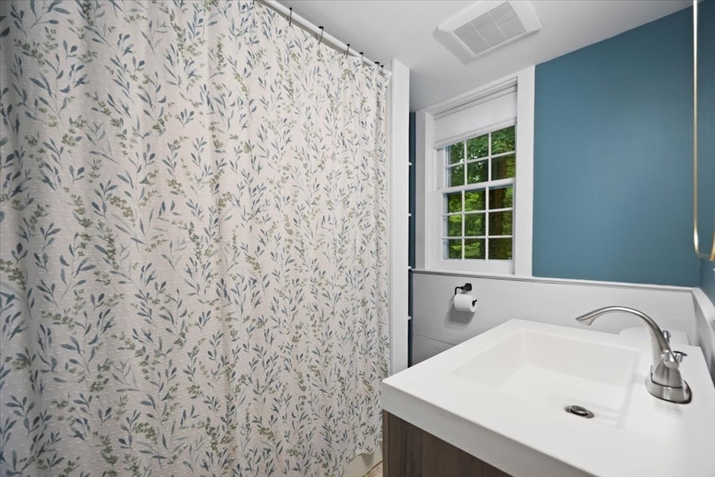 217 County Road Bourne, MA 02532 - Photo 18 of 30 a bathroom with a sink and a window