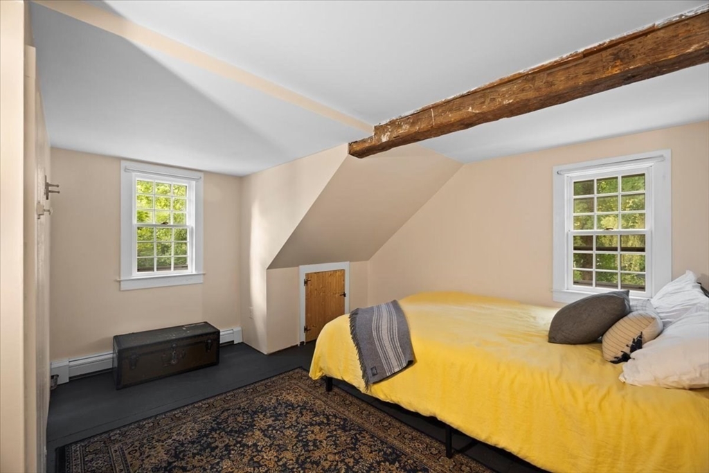 217 County Road Bourne, MA 02532 - Photo 20 of 30 a bedroom with a bed and wooden floor