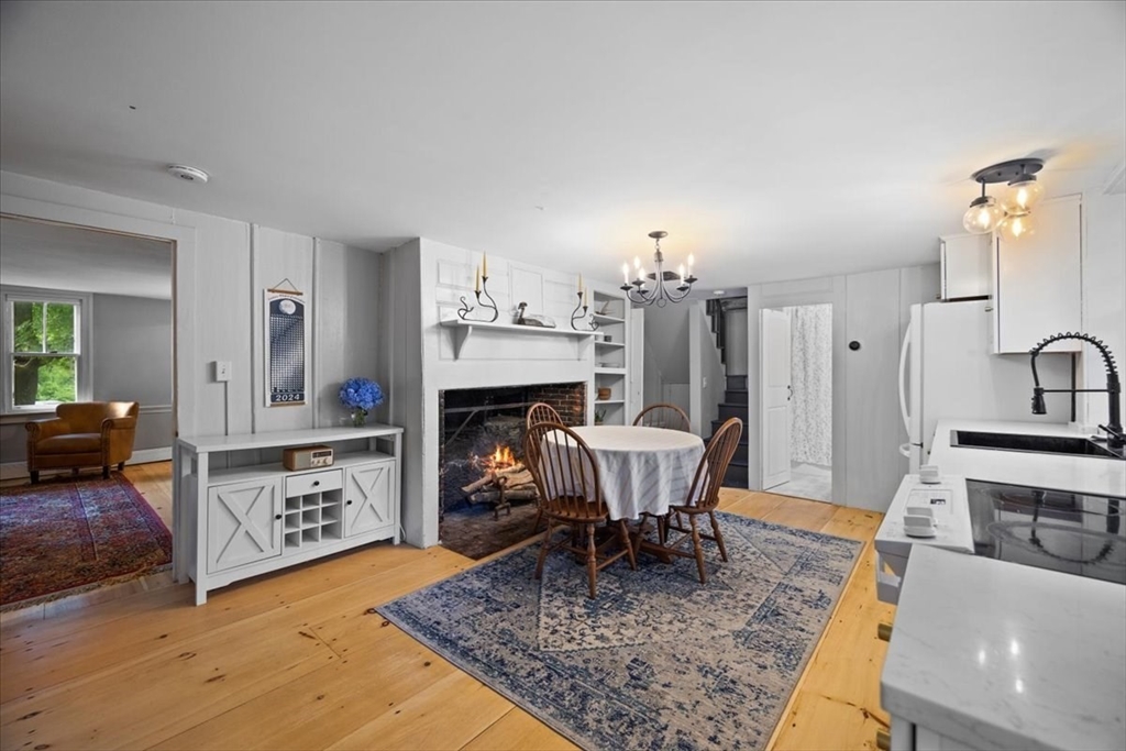 217 County Road Bourne, MA 02532 - Photo 3 of 30 a view of a livingroom with furniture and a fireplace