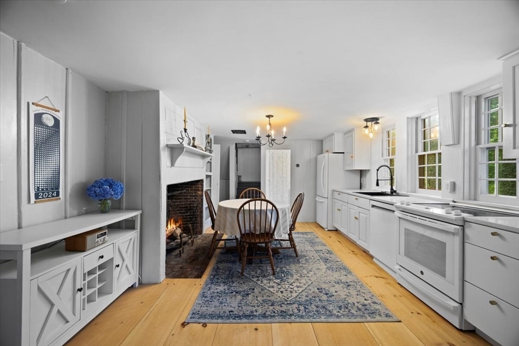 217 County Road Bourne, MA 02532 - Photo 4 of 30 a living room with furniture rug and a fireplace