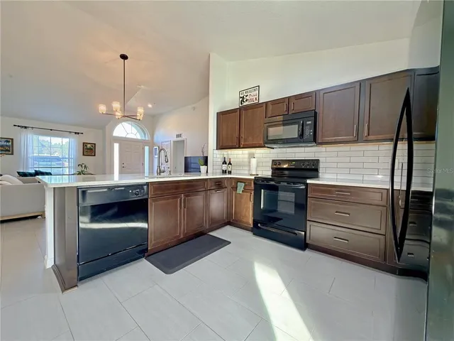 a bedroom with a bed and a table