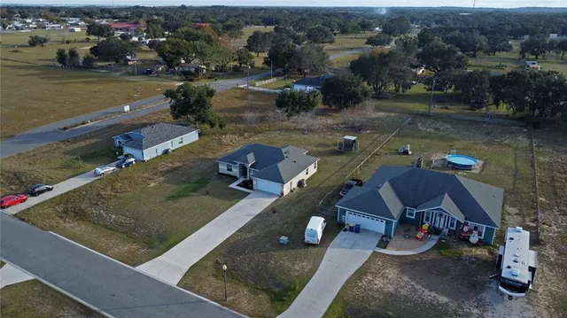 a living room with furniture a couch and a flat screen tv