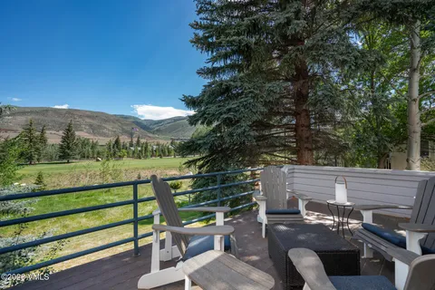 a view of a chairs and table in the outdoor