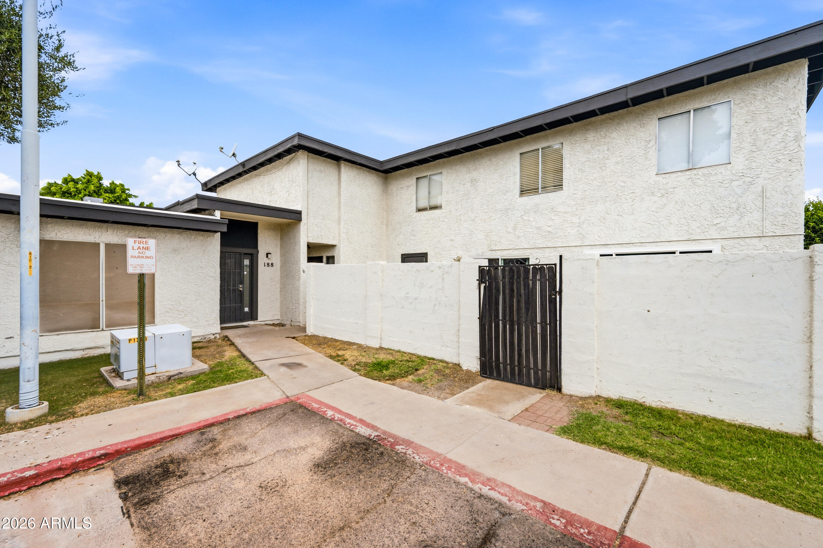 1051 South Dobson Road, Unit 187 Mesa, AZ 85202 - Photo 5 of 18 a front view of house with pathway