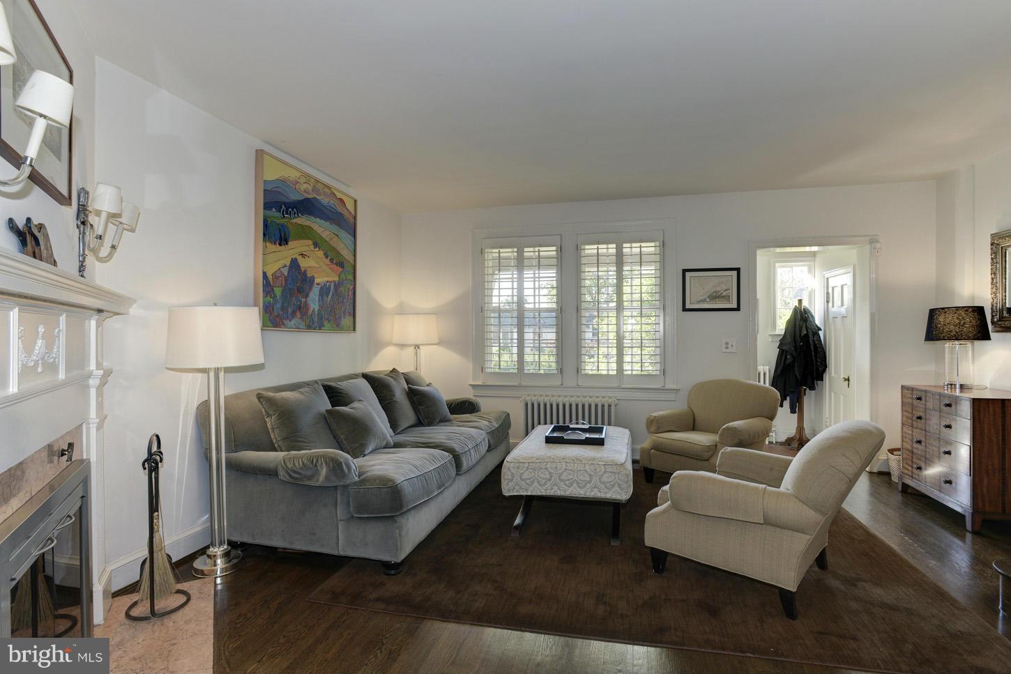3813 T Street Northwest Washington, DC 20007 - Photo 4 of 24 a living room with furniture and a fireplace