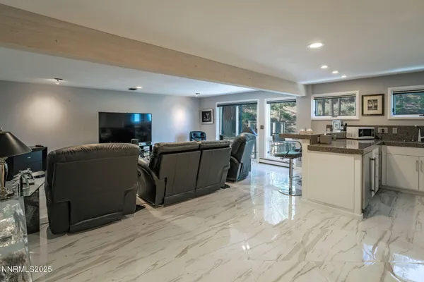 a spacious bedroom with a bed and large window