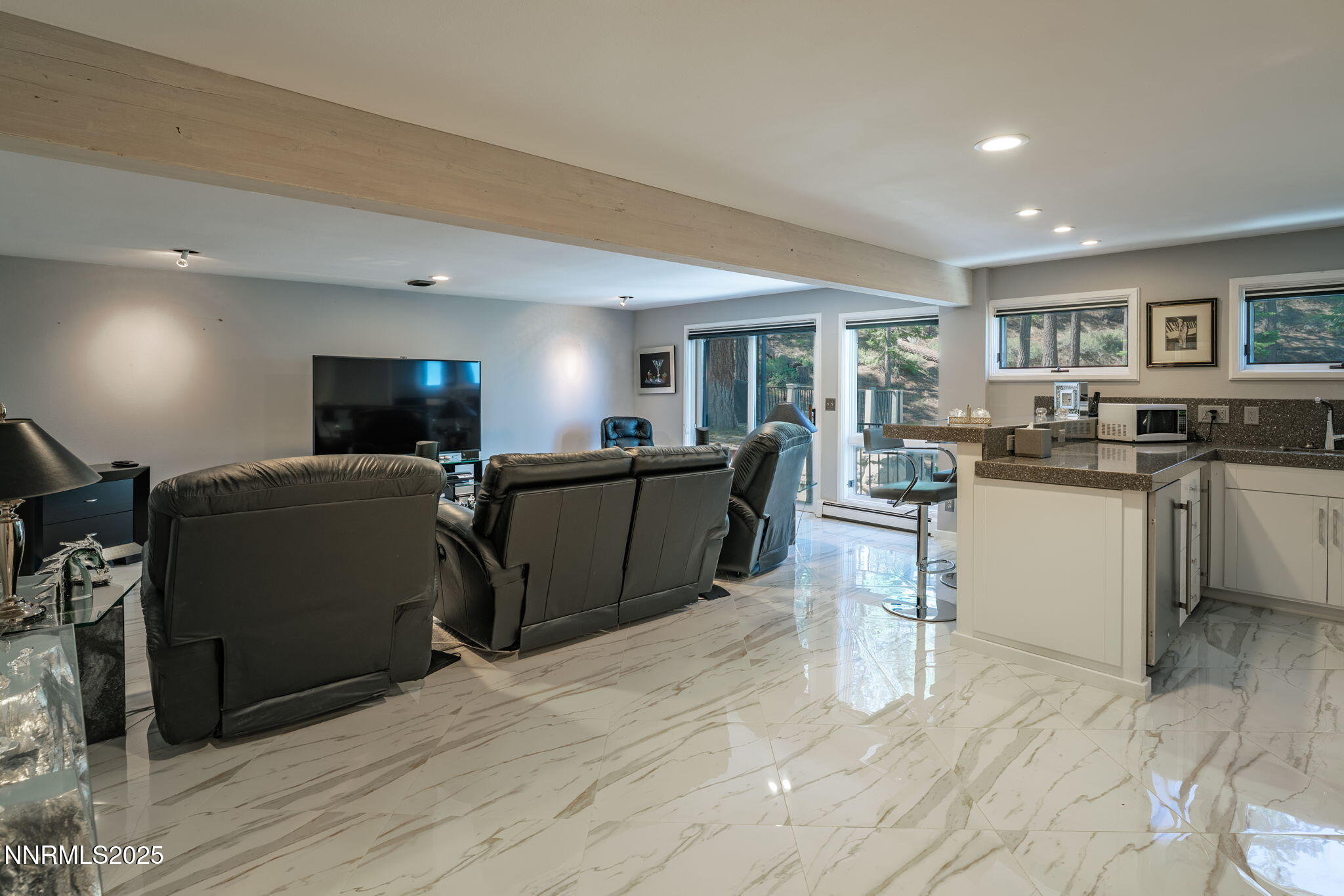 275 Chukkar Drive Glenbrook, NV 89413 - Photo 17 of 29 a view of a kitchen with a sink stainless steel appliances cabinets and a wooden floor