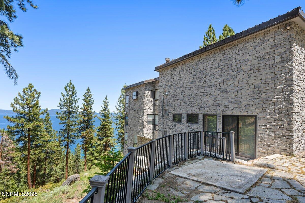 275 Chukkar Drive Glenbrook, NV 89413 - Photo 2 of 29 a backyard of a house with table and chairs