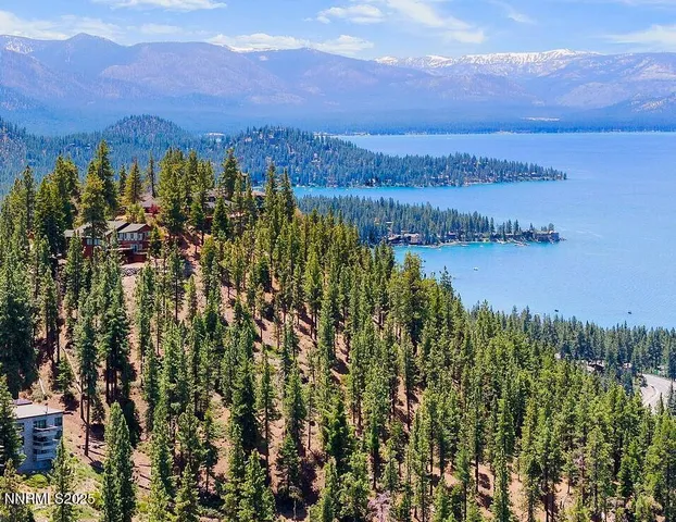a view of a lake with houses in the back