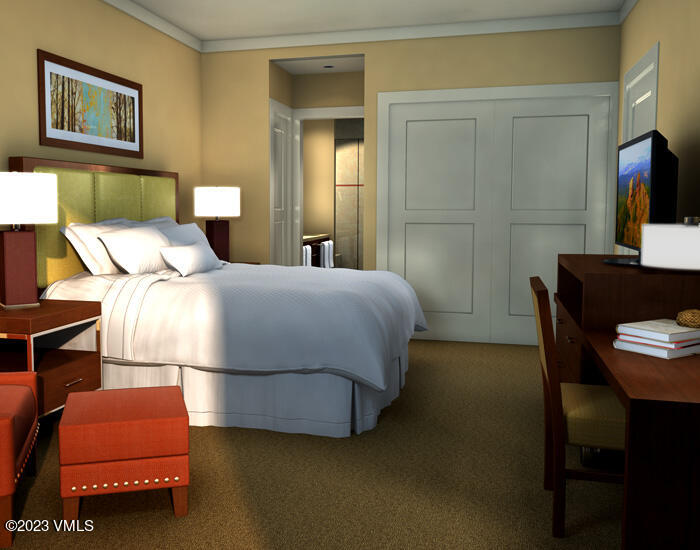 a bedroom with a bed and a couch