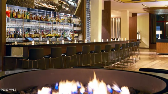 a view of a chairs and table in the balcony