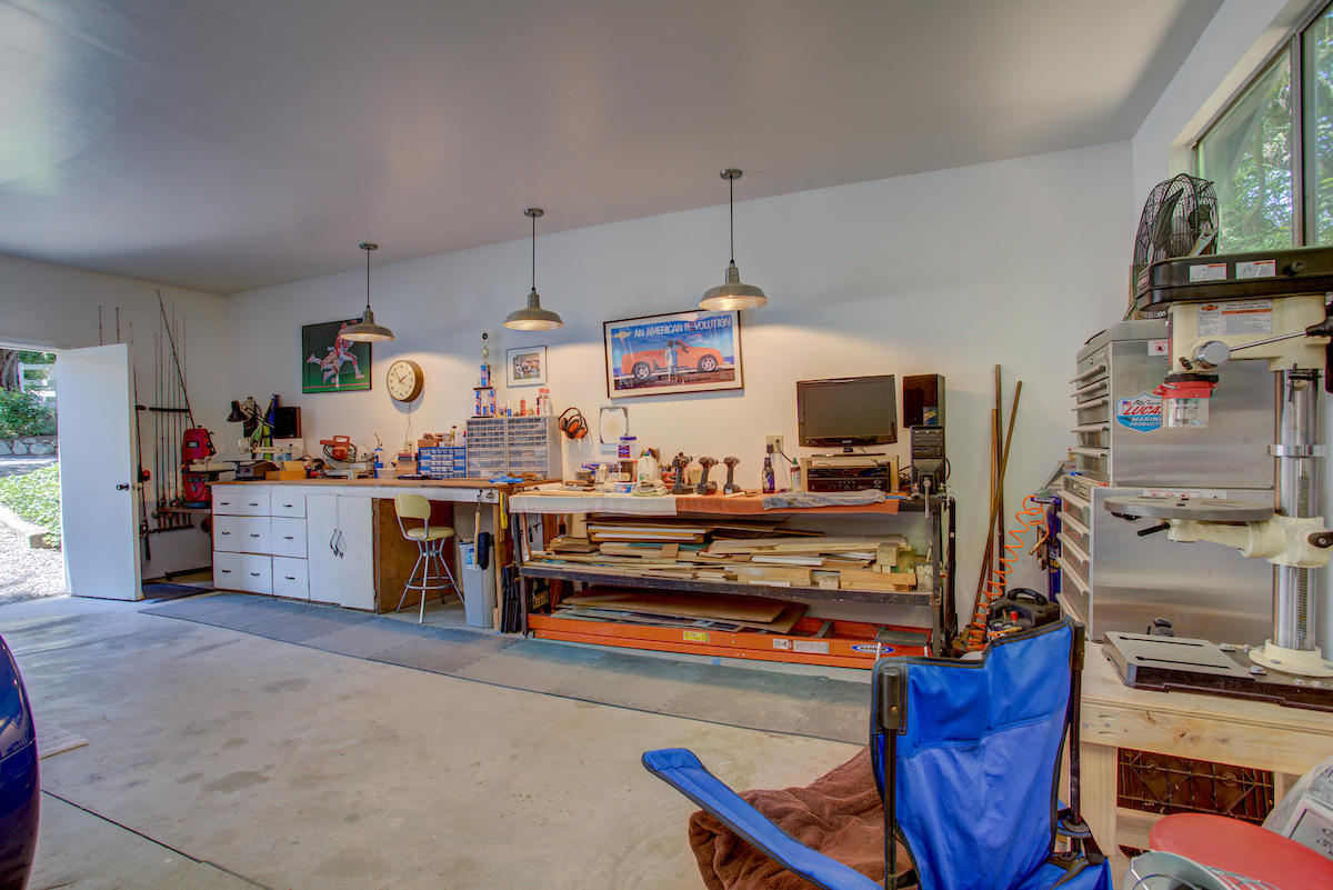 3184 Old Stage Road Central Point, OR 97502 - Photo 24 of 31 a kitchen with stainless steel appliances and a wooden floor