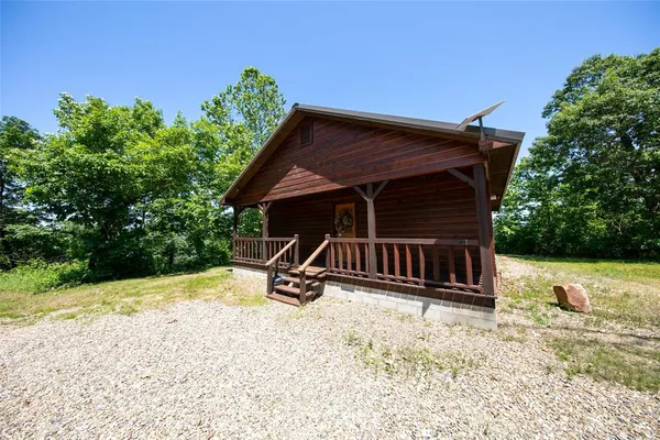 a view of backyard with a garden and deck