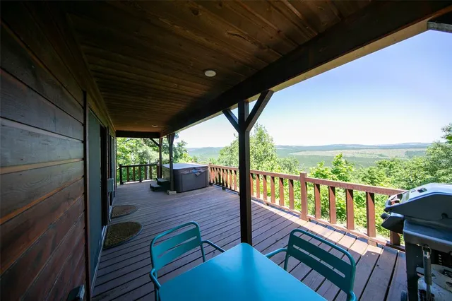 a view of a balcony with couch and wooden floor