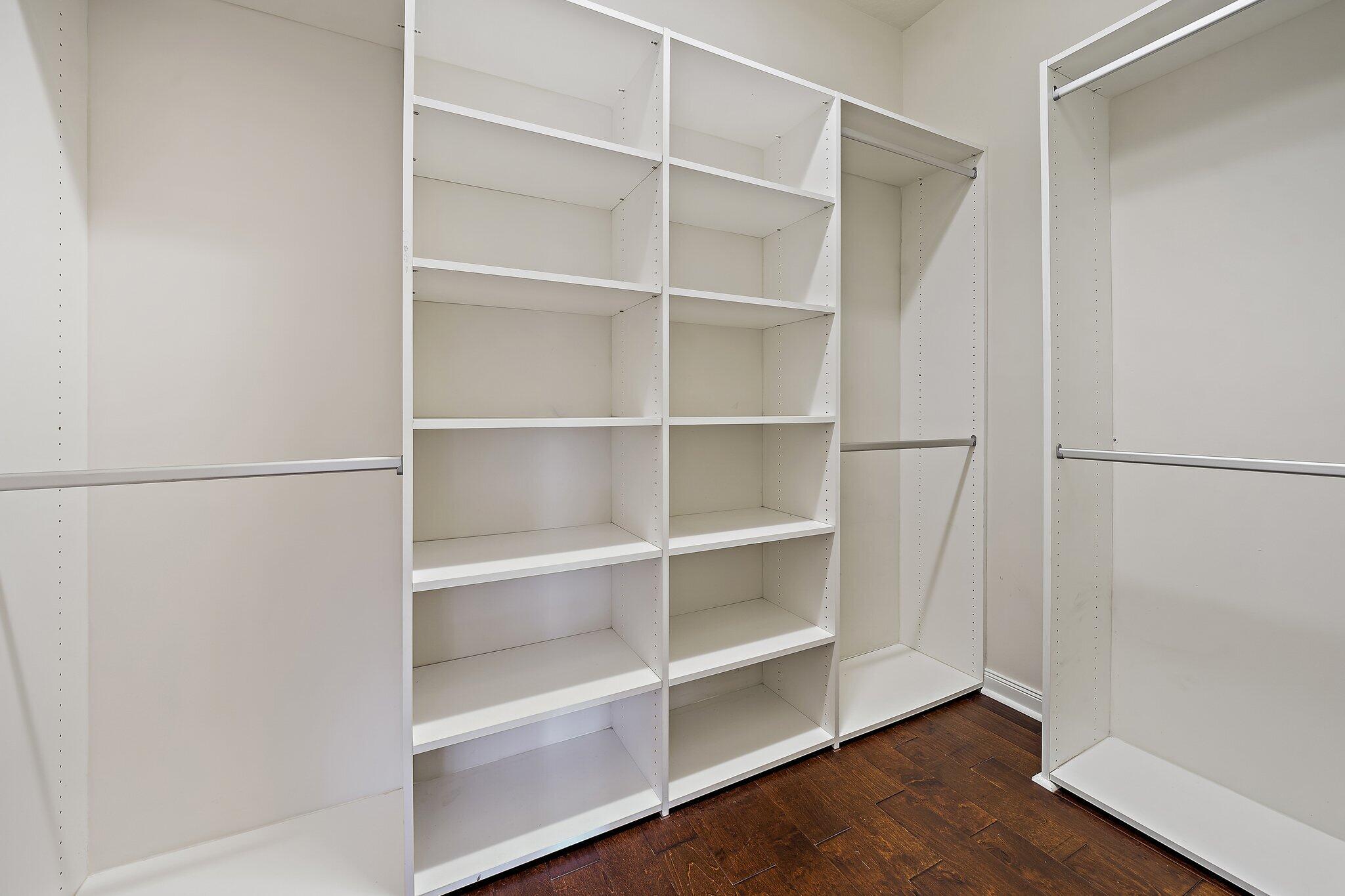3253 Duncombe Drive Jupiter, FL 33458 - Photo 17 of 33 a view of walk in closet with empty racks