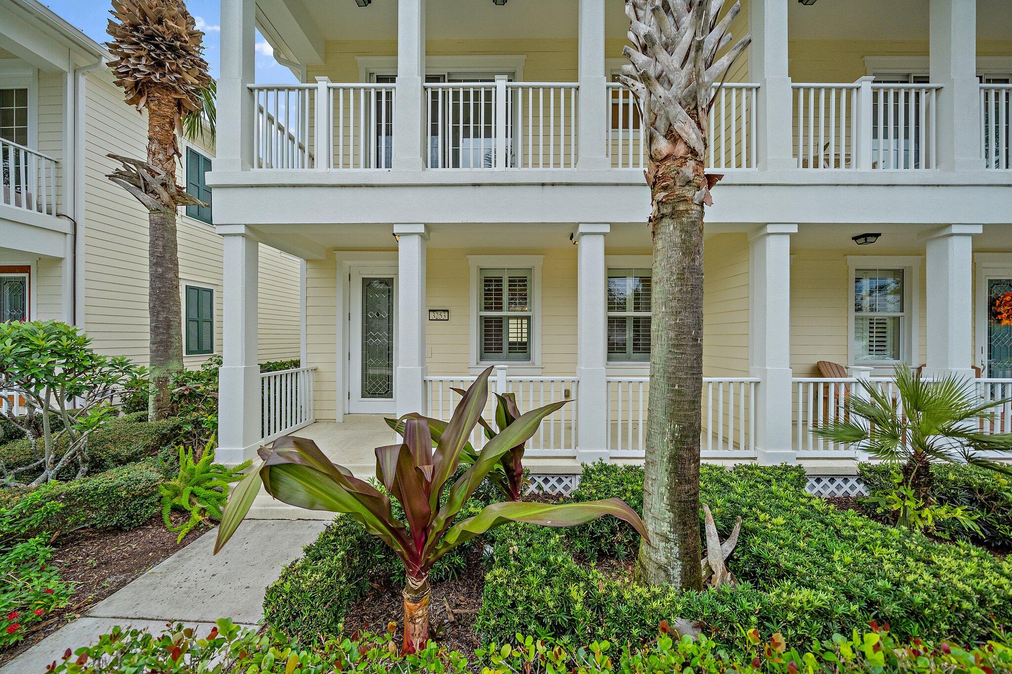 3253 Duncombe Drive Jupiter, FL 33458 - Photo 2 of 33 front view of a house with a small yard