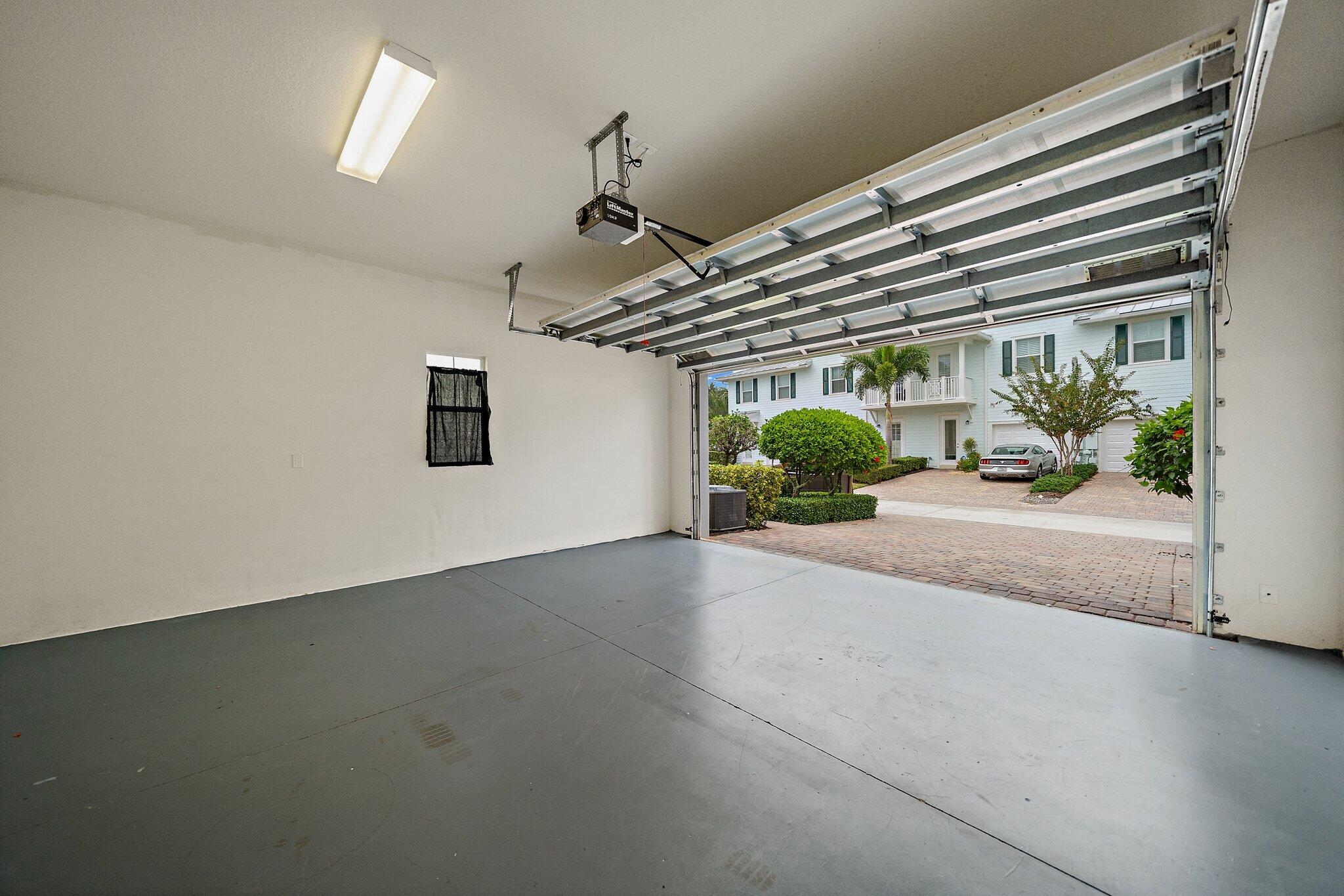 3253 Duncombe Drive Jupiter, FL 33458 - Photo 28 of 33 a view of a garage