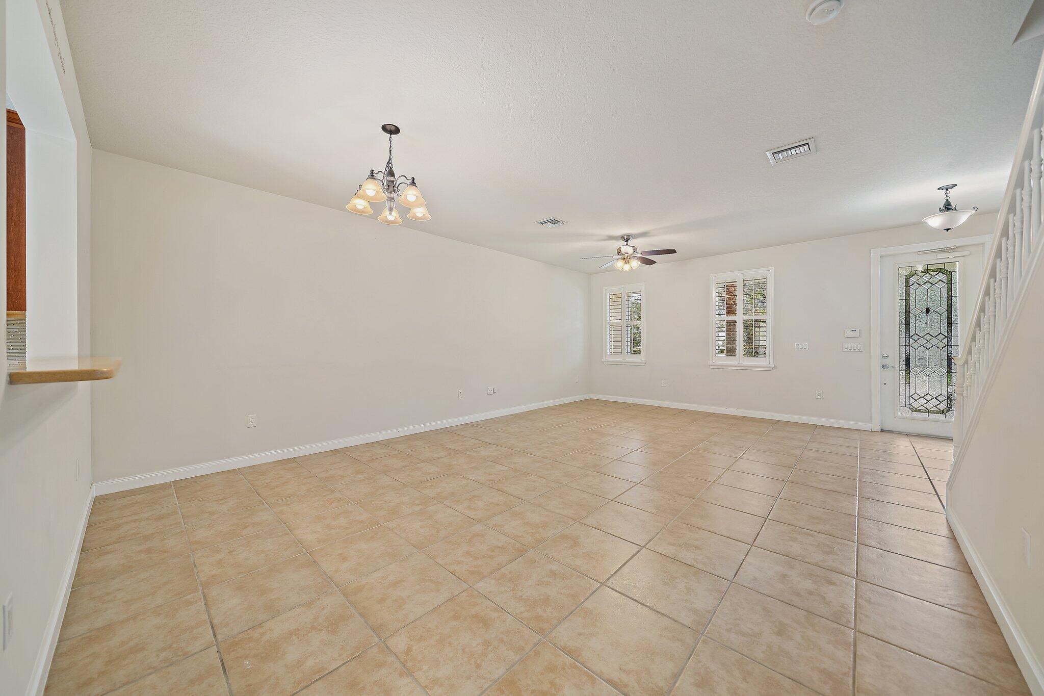 3253 Duncombe Drive Jupiter, FL 33458 - Photo 7 of 33 a view of an empty room with a window