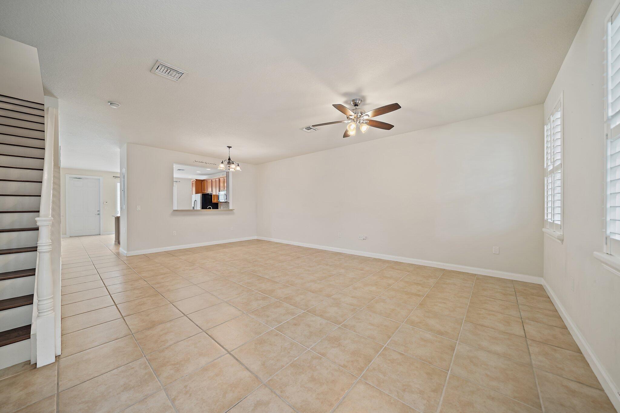 3253 Duncombe Drive Jupiter, FL 33458 - Photo 8 of 33 an empty room with a empty space and windows