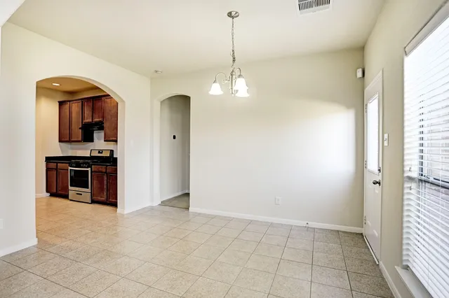 a view of kitchen with sink and cabinets