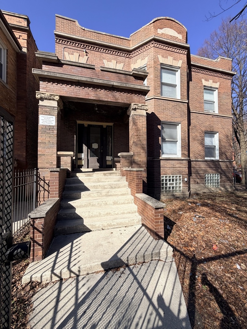 7700 South Green Street, Unit 1 Chicago, IL 60620 - Photo 1 of 11 a view of a building with a large window