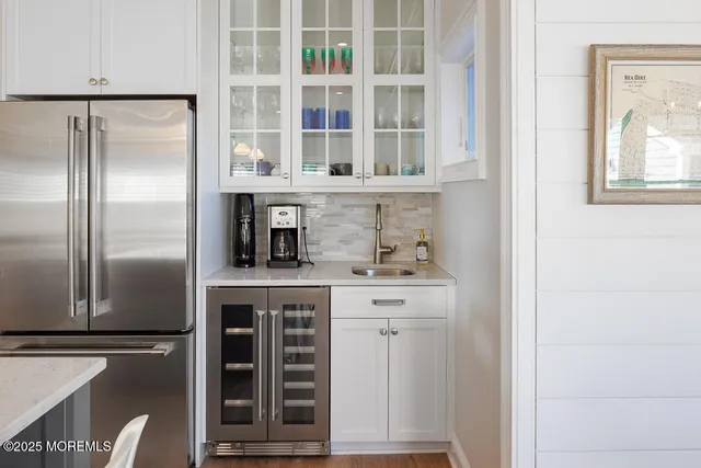 a bathroom with a sink toilet a mirror and shower