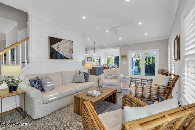 a view of a chairs and table in backyard of the house
