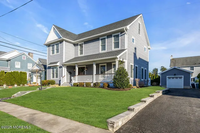 a front view of a house with a yard table and chairs