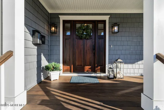 a kitchen with stainless steel appliances granite countertop a stove a refrigerator a oven a island a dining table and chairs