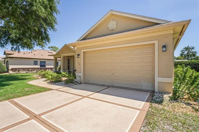 a bathroom with a granite countertop sink a mirror and a shower
