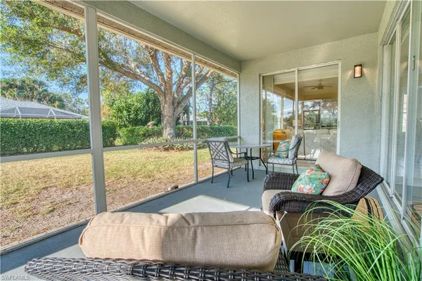 a living room with large windows