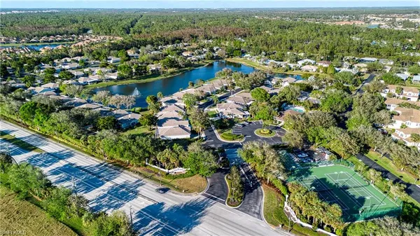 an aerial view of residential house with outdoor space and lake view