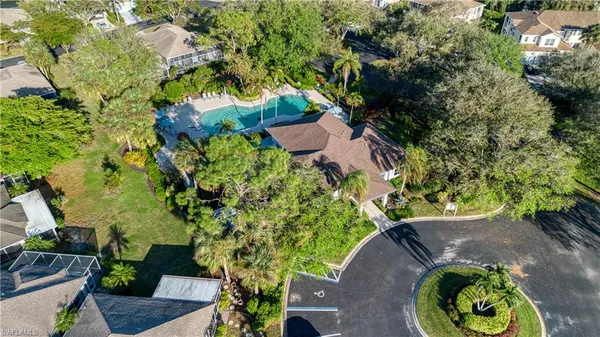an aerial view of a house with a yard and garden