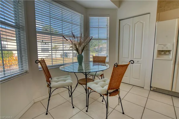 a view of a dining room with furniture and window