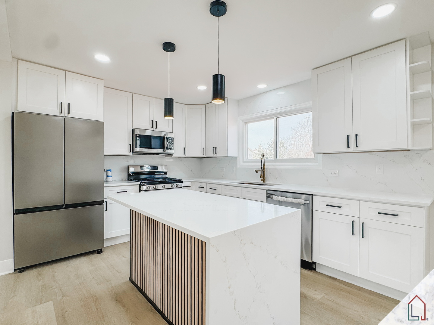 50 Willow Road Matteson, IL 60443 - Photo 6 of 23 a kitchen with stainless steel appliances a refrigerator a stove a sink and white cabinets