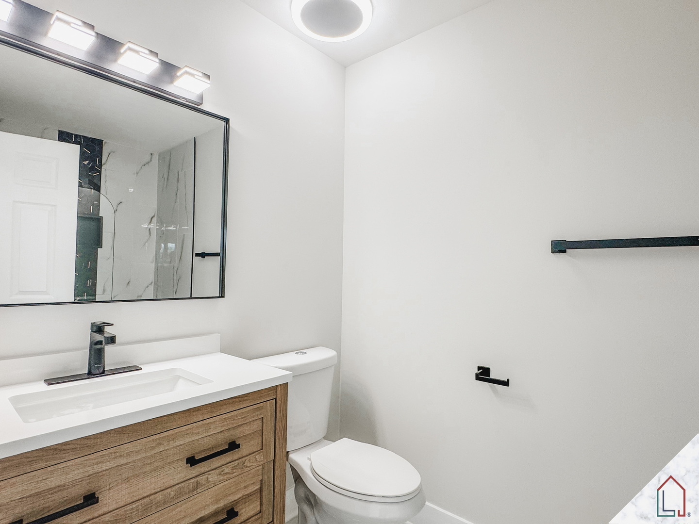 50 Willow Road Matteson, IL 60443 - Photo 9 of 23 a bathroom with a sink a toilet and mirror