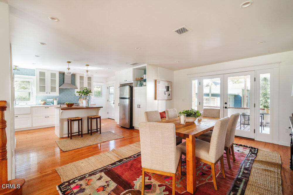 2089 Mar Vista Avenue Altadena, CA 91001 - Photo 11 of 32 a dining room with wooden floor and large windows
