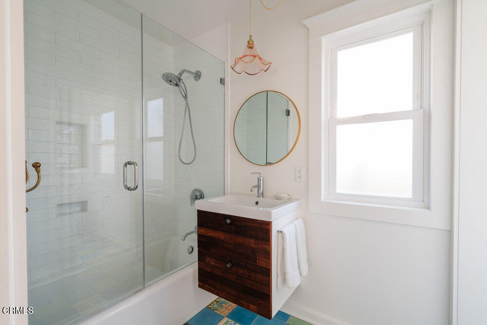 2089 Mar Vista Avenue Altadena, CA 91001 - Photo 18 of 32 a bathroom with a sink a mirror and a shower