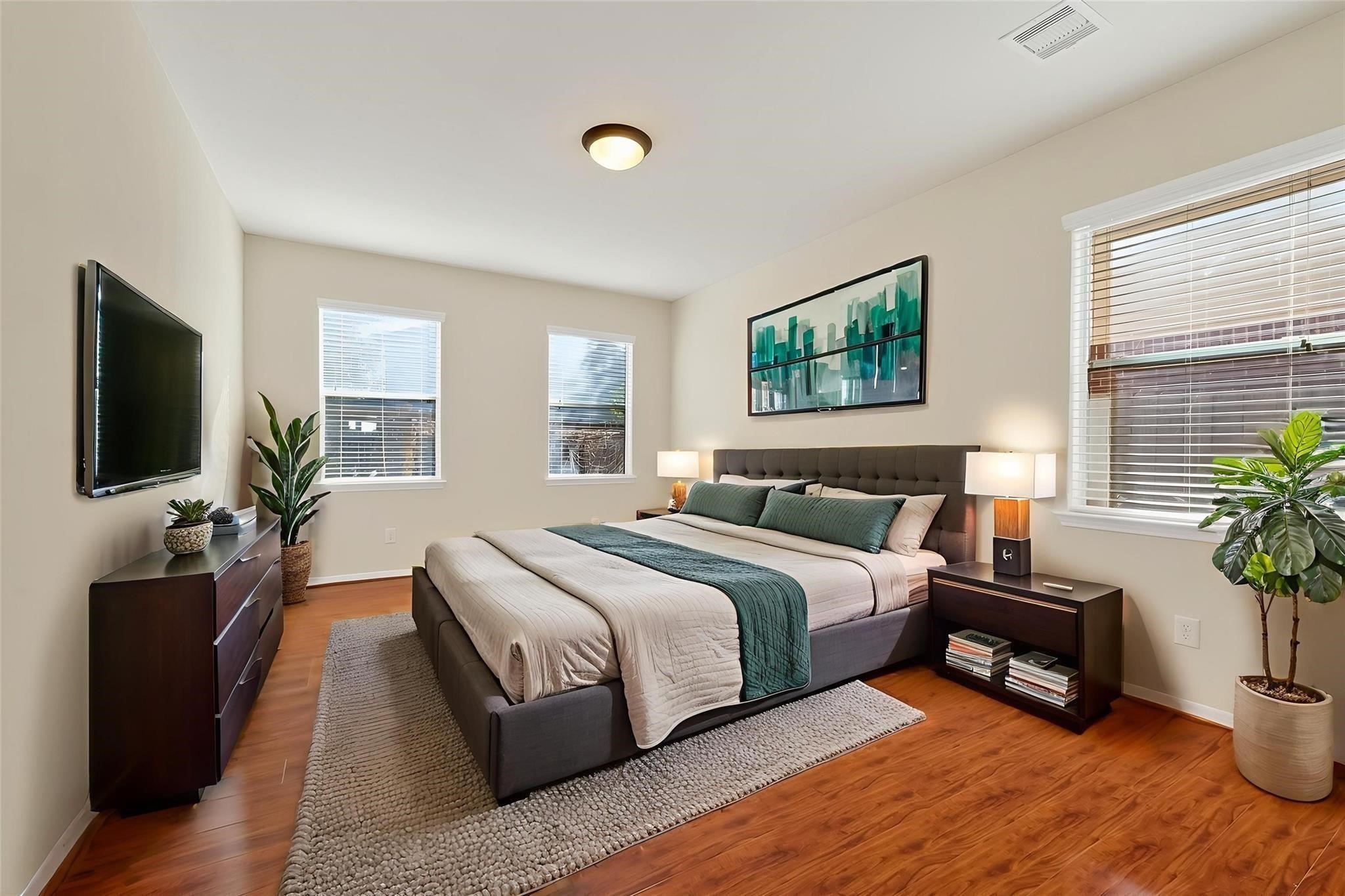 21623 Mid Peak Way Katy, TX 77449 - Photo 16 of 38 a spacious bedroom with a bed and a flat screen television