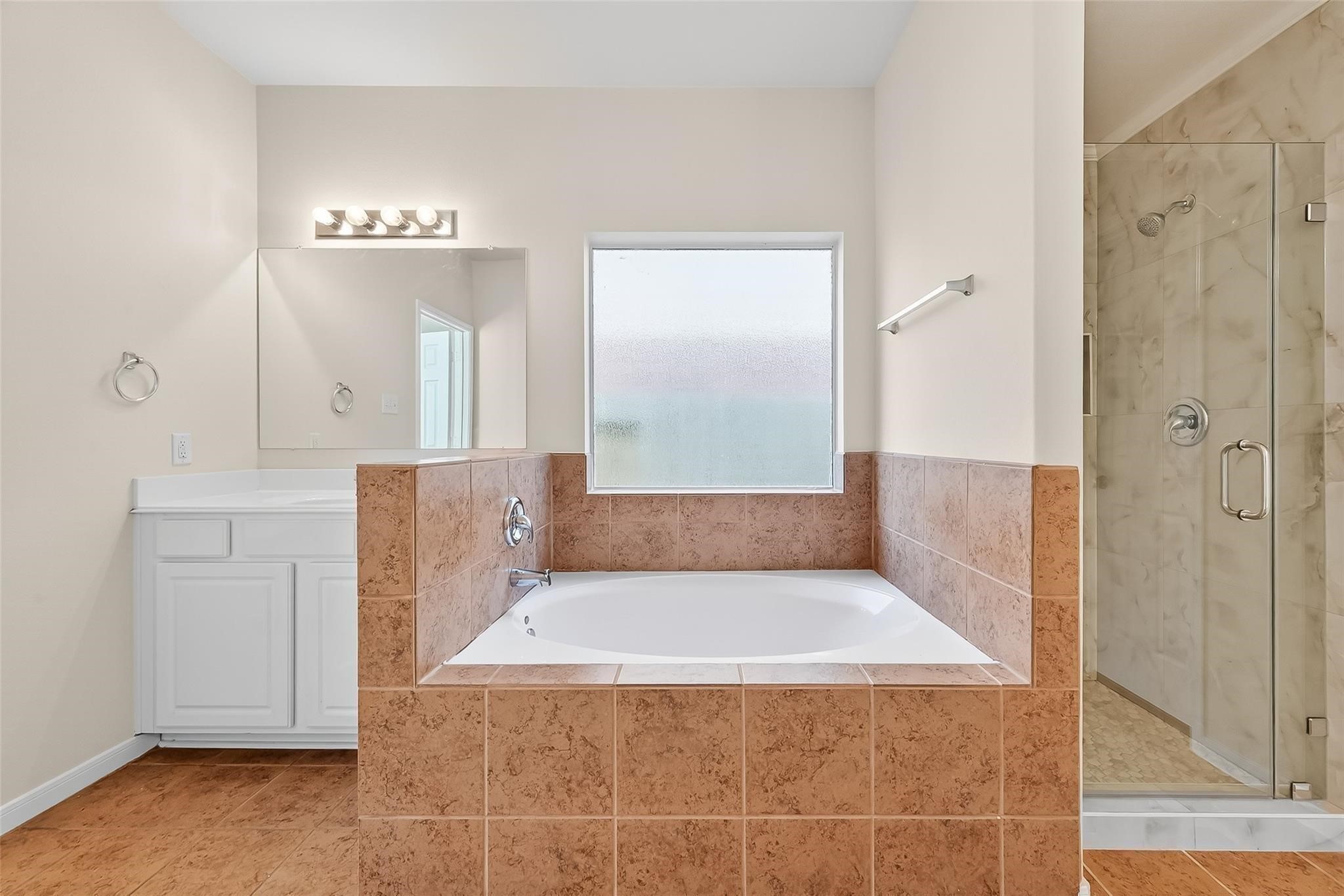 21623 Mid Peak Way Katy, TX 77449 - Photo 18 of 38 a bathroom with a tub shower and sink