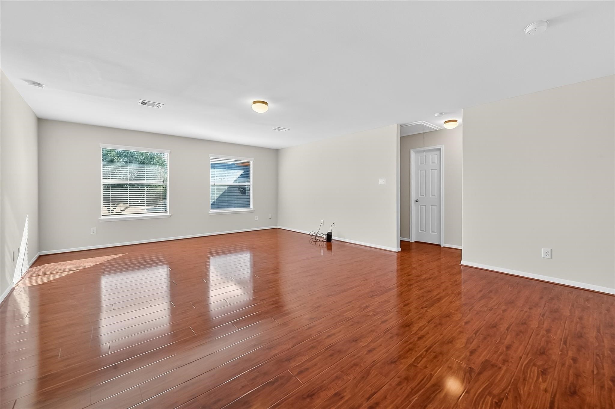 21623 Mid Peak Way Katy, TX 77449 - Photo 21 of 38 a view of empty room with wooden floor and fan
