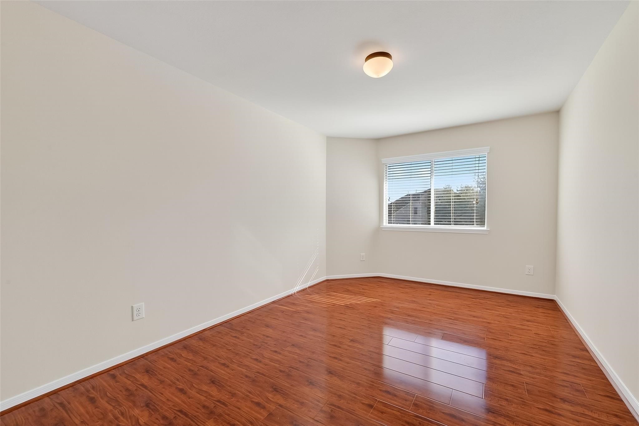 21623 Mid Peak Way Katy, TX 77449 - Photo 23 of 38 an empty room with wooden floor and windows